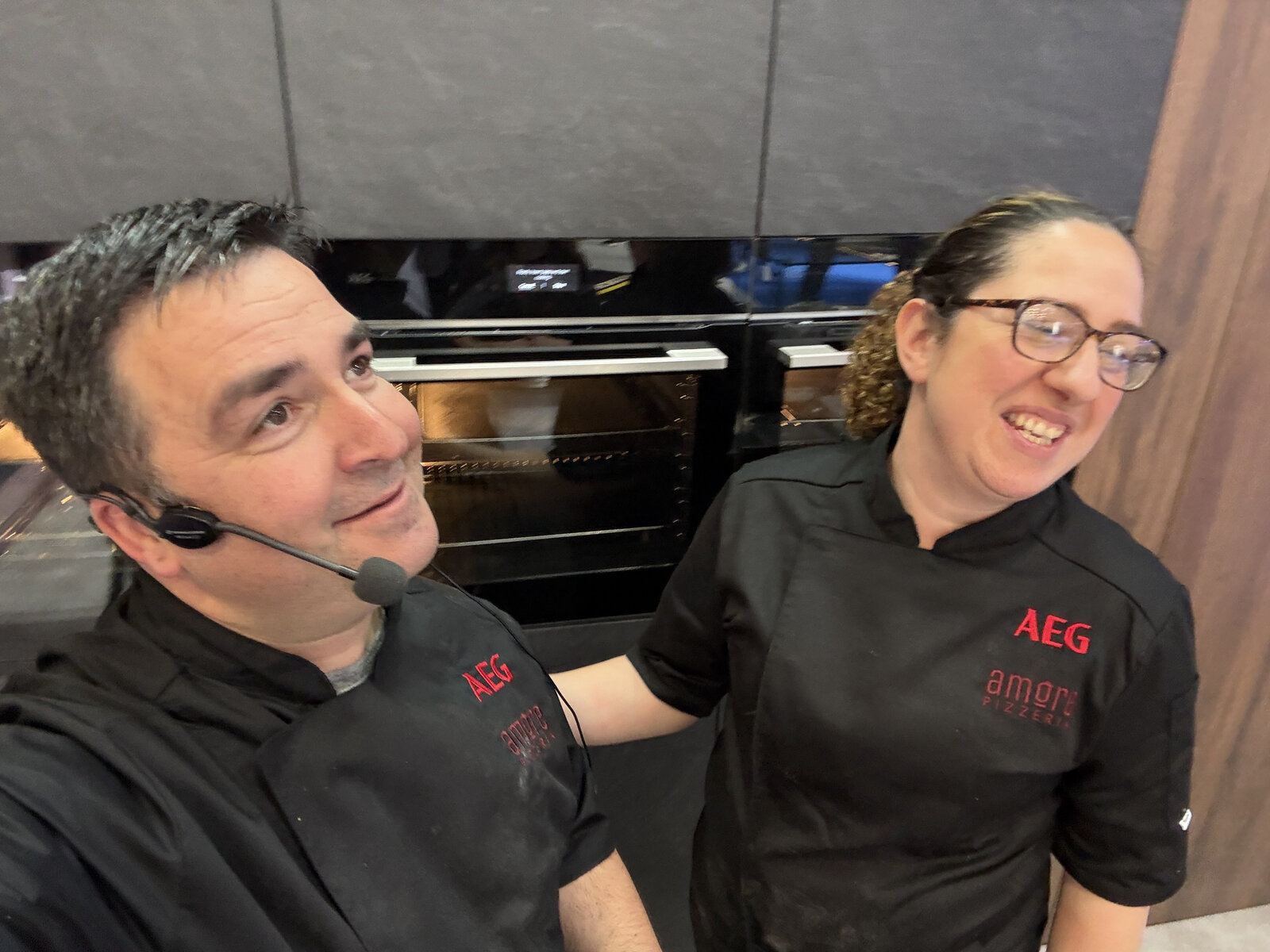 Paulo and the Amore Pizzeria team cooking for AEG at the NEC Birmingham, wearing branded AEG chef jackets